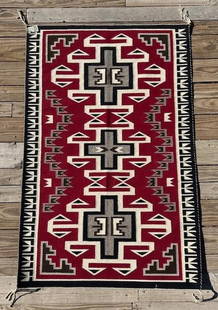 Julia Yazzie Woven Navajo Rug Teec Nos Pos: Teec Nos Pos Navajo woven rug by weaver Julia Yazzie. Originally from True Grit Enterprises in Greasewood AZ. Both sides have the same design with nice vibrant colors. Measures 36" x 55". Domestic or