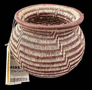 Choco Baskets of the Darien Hand Woven: Choco Basket of the Darien, hand woven. 36 stitches to the inch. 42 coils. 11.5" circumference. 17,400 total stitches with 116 hours of weaving. Made on the Panama Columbia border, the fibers are coll