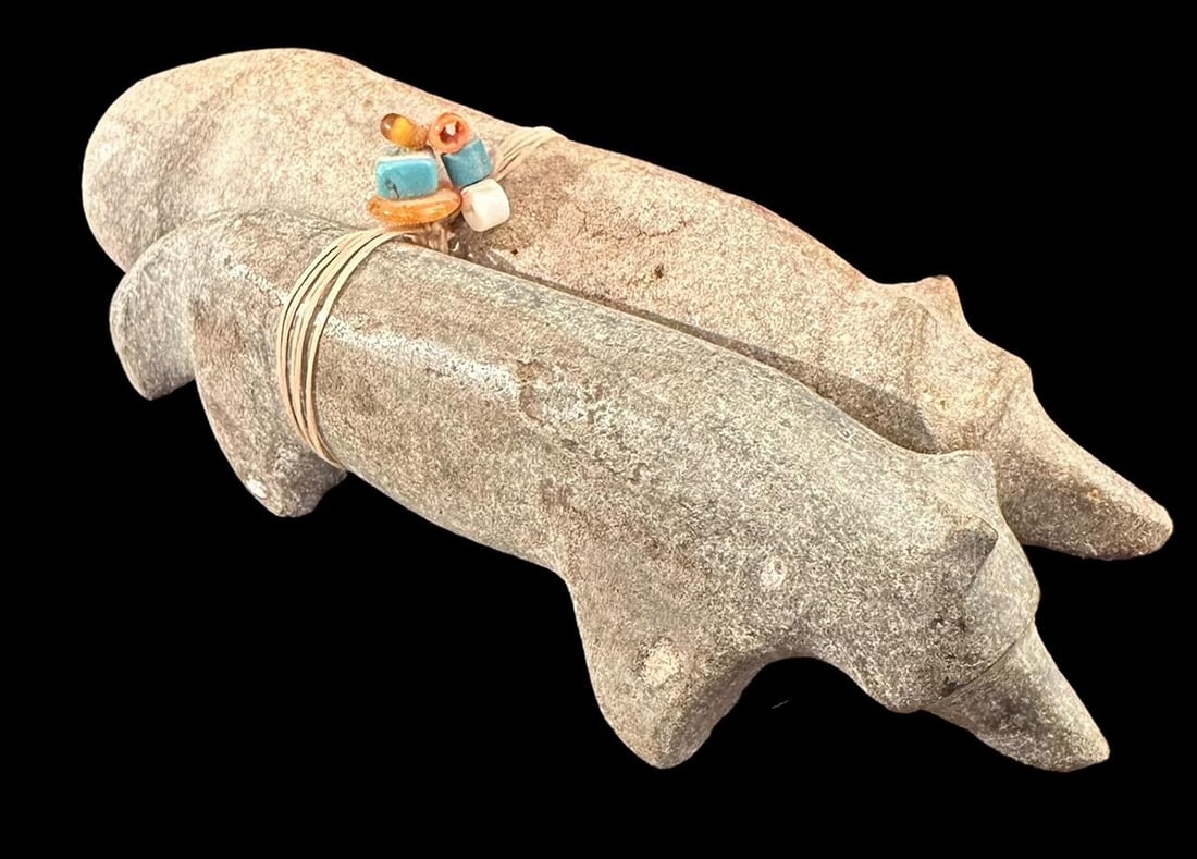 Pair of Stone Carved Wolf Fetishes: Pair of stone carved wolf fetishes with deer sinew, turquoise, coral and amber beads. Unsigned. Measure 5" long. Domestic shipping $12. USPS shipping cost only, no additional fees for in-house materia