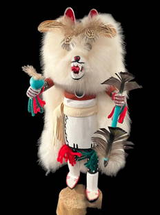 Navajo Wood Carved and Painted "Wolf" Kachina Signed Raphel Sarracino: Navajo hand carved wood and painted kachina. Titled "Wolf" and signed Raphael Sarracino. Carved wood with feather and fur accents. Measures 14" tall. Domestic shipping $16. USPS shipping cost