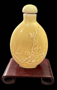 Yellow Celadon Snuff Bottle with Wood Stand: Yellow Celadon snuff bottle with wood stand. Measures 2.25" tall. Domestic shipping $8. USPS shipping cost only, no additional fees for in-house materials or handling. International shipping calculate