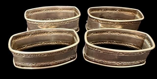 Set of Sterling Napkin Rings: Set of four oval sterling napkin rings. Marked sterling. Weighs 2 oz. Measure about 2.5" x 1.25" x .75". Domestic shipping $8.