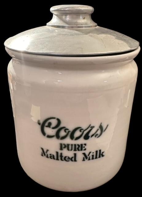 Antique Coors Pure Malted Milk Advertising Canister: Antique Coors Pure Malted Milk advertising ironstone canister with original tin lid. Cannister measures 7" across and with lid measures 9.5" tall. Domestic shipping $14.
