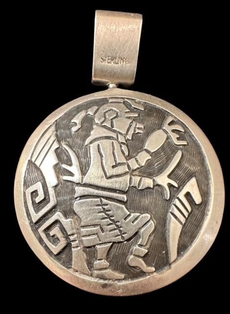 Native American Sterling Reversible Pendant Mudhead and Kokopelli: Native American sterling reversible pendant. Mudhead on one side and Kokopelli dancer on the other. Measures 1.5" x 2". Domestic shipping $8.