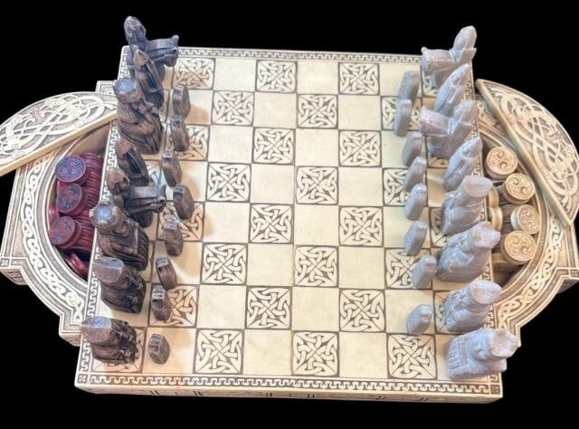Replica Isle of Lewis Chess Board Set Complete with 32 Chess Pieces and Checkers: Replica of Isle of Lewis chess board with chess pieces and checker pieces. Faux ivory board with storage slots for the checkers on the side. Heavy. Measures 17.5" x 11.5" x 1.5". Very nice set. Domest