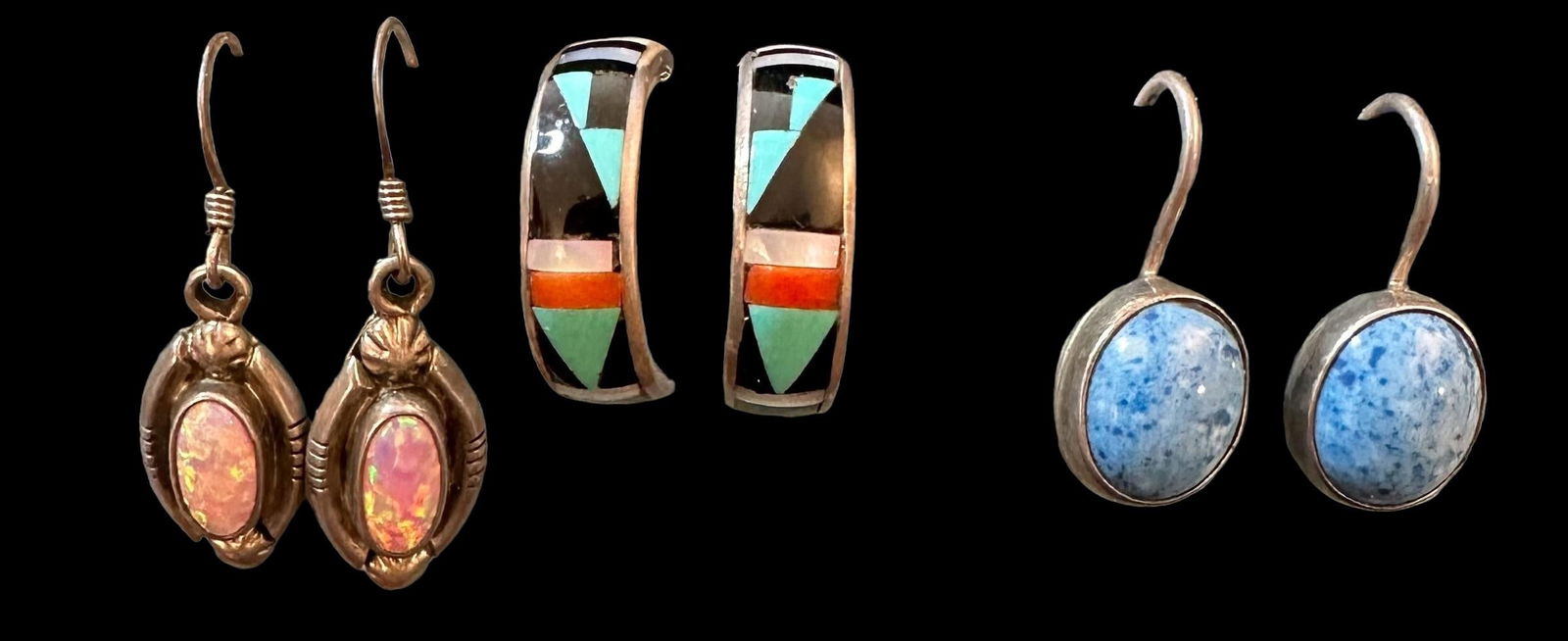 Lot of Three Native American Sterling and Stone Pierced Earrings: Lot of three Native American, Zuni and Navajo, sterling and stone pierced earring sets. 1) Zuni inlaid with onyx, coral, Mother of pearl and turquoise. Signed. 2) Navajo inlaid with turquoise. Signed