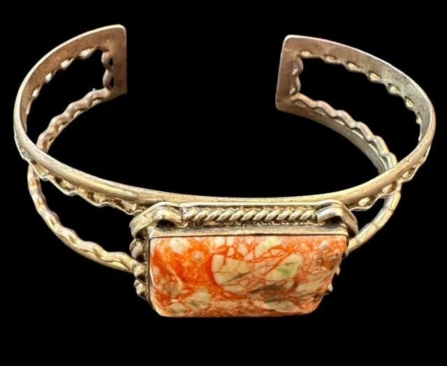 Sterling and Jasper Cuff Bracelet Signed DR: Sterling cuff bracelet with Jasper stone. Marked .925 and China. Measures 6.75" with a 1.25" cuff opening. Domestic shipping $10.