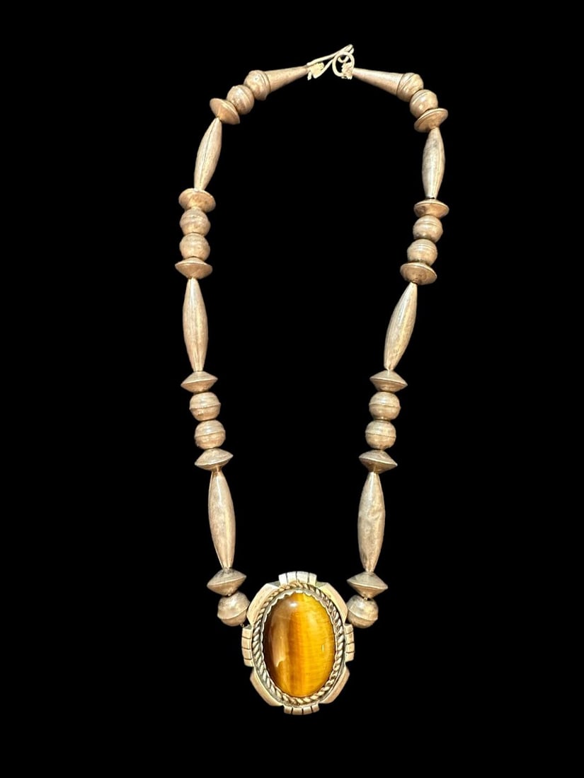 Native American Signed Sterling and Tiger's Eye Stone Necklace: Vintage sterling necklace with tiger's eye stone. Initial signature appears to be BKW. See photos for details. Measures 16". Domestic shipping $10.