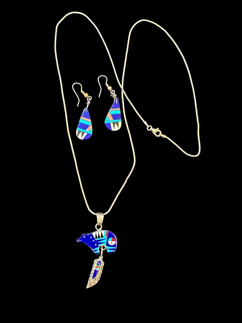 Zuni Native American Earrings and Pendant Necklace Set: Native American earring and pendant necklace set. Pendant measures 2" and is a bear fetish with inlaid stone. Chain measures 24" and is sterling. Earrings are inlaid with lapis in a feather motif. Dom