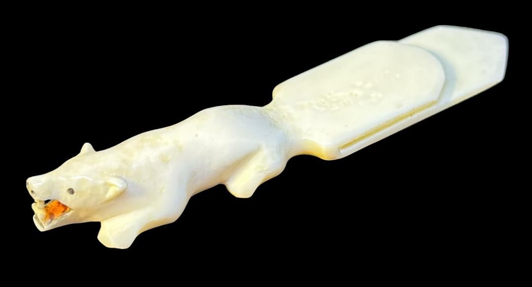 Alaskan Carved Walrus Tusk Bookmark: Alaskan walrus tusk carved bookmark. End has a figural polar bear design. Ca 20th century. Measures 3" long by 5/8" wide. Domestic shipping $10.