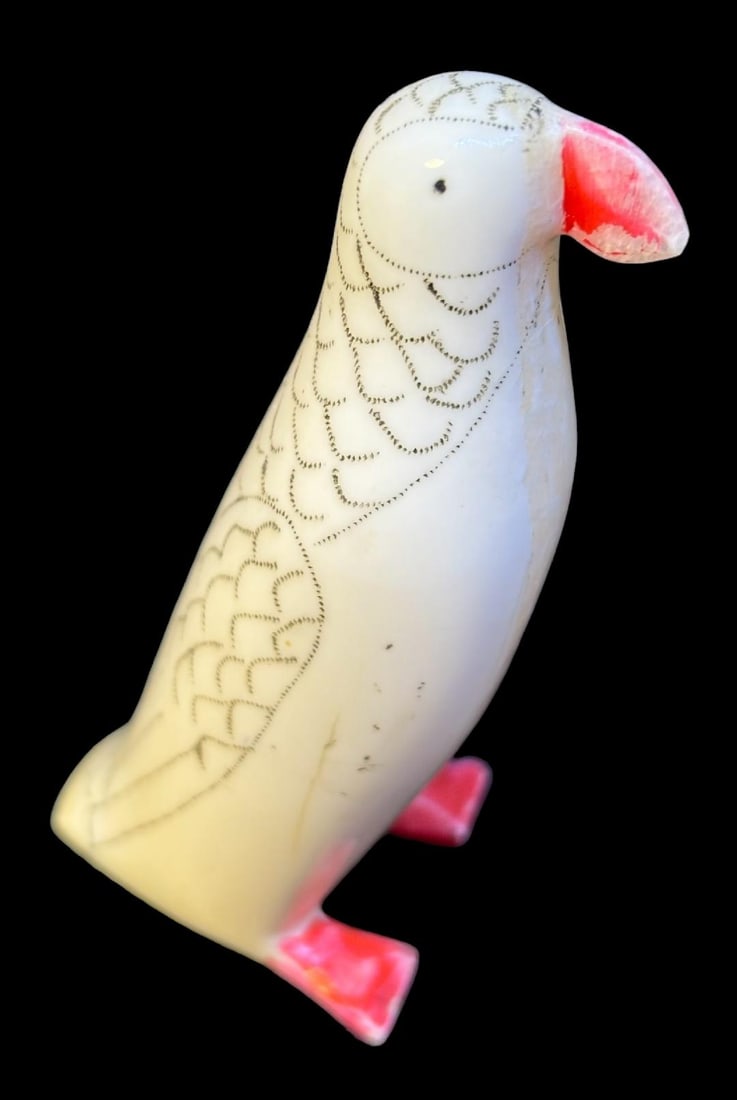Vintage Alaskan Eskimo Walrus Tusk Carved Scrimshaw Puffin Bird Figure: Alaskan Inuit carved walrus tusk puffin bird figure. Dark line runs from head to foot. Color applied to bill and feet. Nice scrimshaw effect to back feathers. Measures 2.5". Domestic shipping $8.