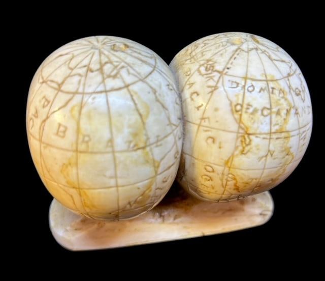 Vintage Hand Carved Inuit Walrus Tusk Globe Paperweight Inuit Early 1900s: Vintage hand carved Inuit Walrus tusk paperweight. Figural of side-by-side world globes. Measures 2.5" x 3.25". Each has 2 holes on top, unknown purpose. Domestic shipping $12.