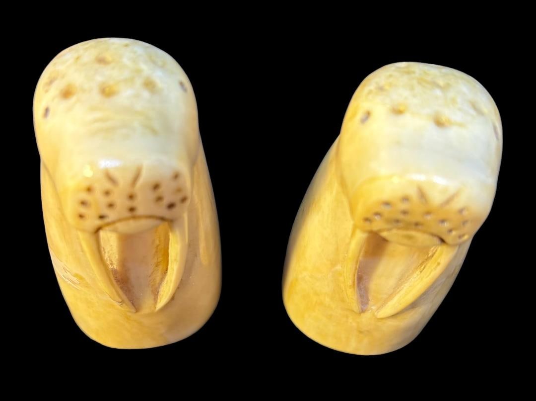 Vintage Eskimo Walrus Tusk Carved Salt and Pepper Shakers or Toothpick Holders: Vintage carved walrus tusk Walrus shaped salt and pepper shakers or toothpick holders. Ca 19th century. Measure 2.25" high by 1" wide. Domestic shipping $12.