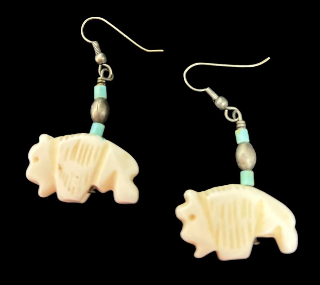 Native American Carved Buffalo and Sterling Earrings: Native American carved bone buffalo fetish earrings with sterling spacer bead. Measures 1.5" x 1". Domestic shipping $6.
