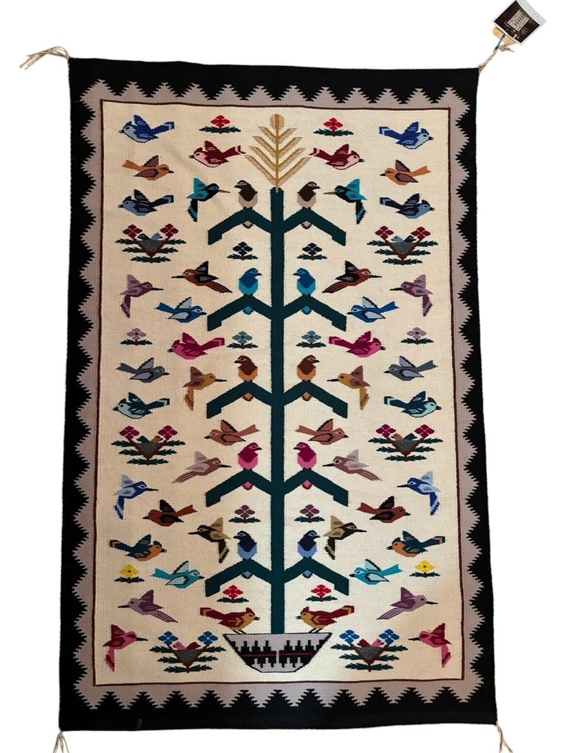 Marie Sellers Navajo Woven Tree of Life Rug: Tree of Life woven rug by weaver Marie Sellers. Originally from Hubbell Trading Co. in Cedar Ridge AZ. Includes photo of weaver. Same design on front and back with nice vibrant colors. Measures 35" x 