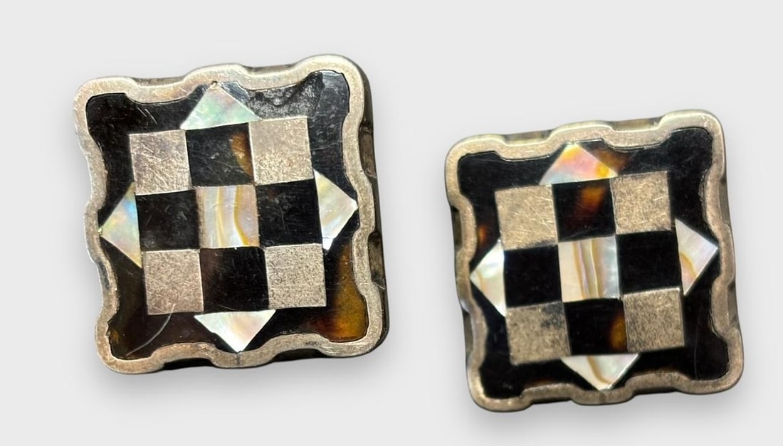 Mexico Silver Checkerboard Cuff Links: Sterling silver Mexico checkerboard pattern cufflinks in onyx and mother of pearl. Marked PGG, Mexico and .925. Size is a 3/4" square. Domestic shipping $6