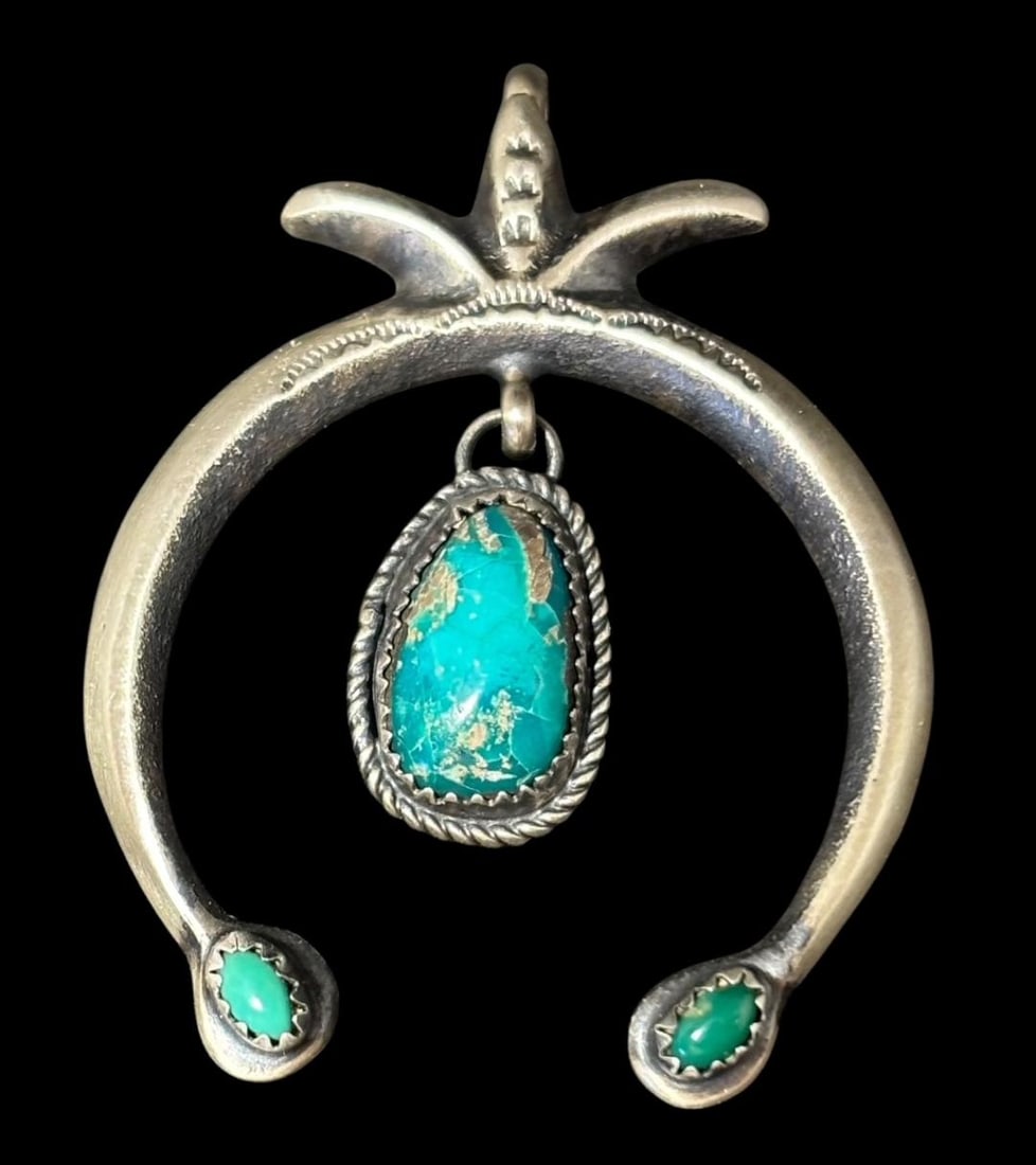 Native American Navajo Signed MC Sterling and Turquoise Naja Pendant: Native American sterling and turquoise Naja pendant. Marked sterling and signed MC. Measures 1.5" x 2". Domestic shipping $8.