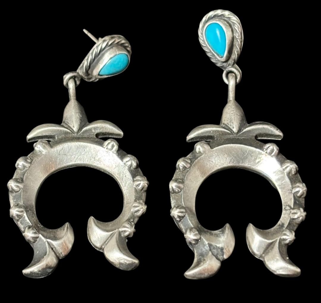 Native American Navajo Naja Pierced Earrings Running Bear: Native American Navajo Naja shaped pierced earrings with turquoise accent. Marked .925 and signed RB with additional Bear Hallmark stamp for Running Bear. Measures 1" x 2". Domestic shipping $10.