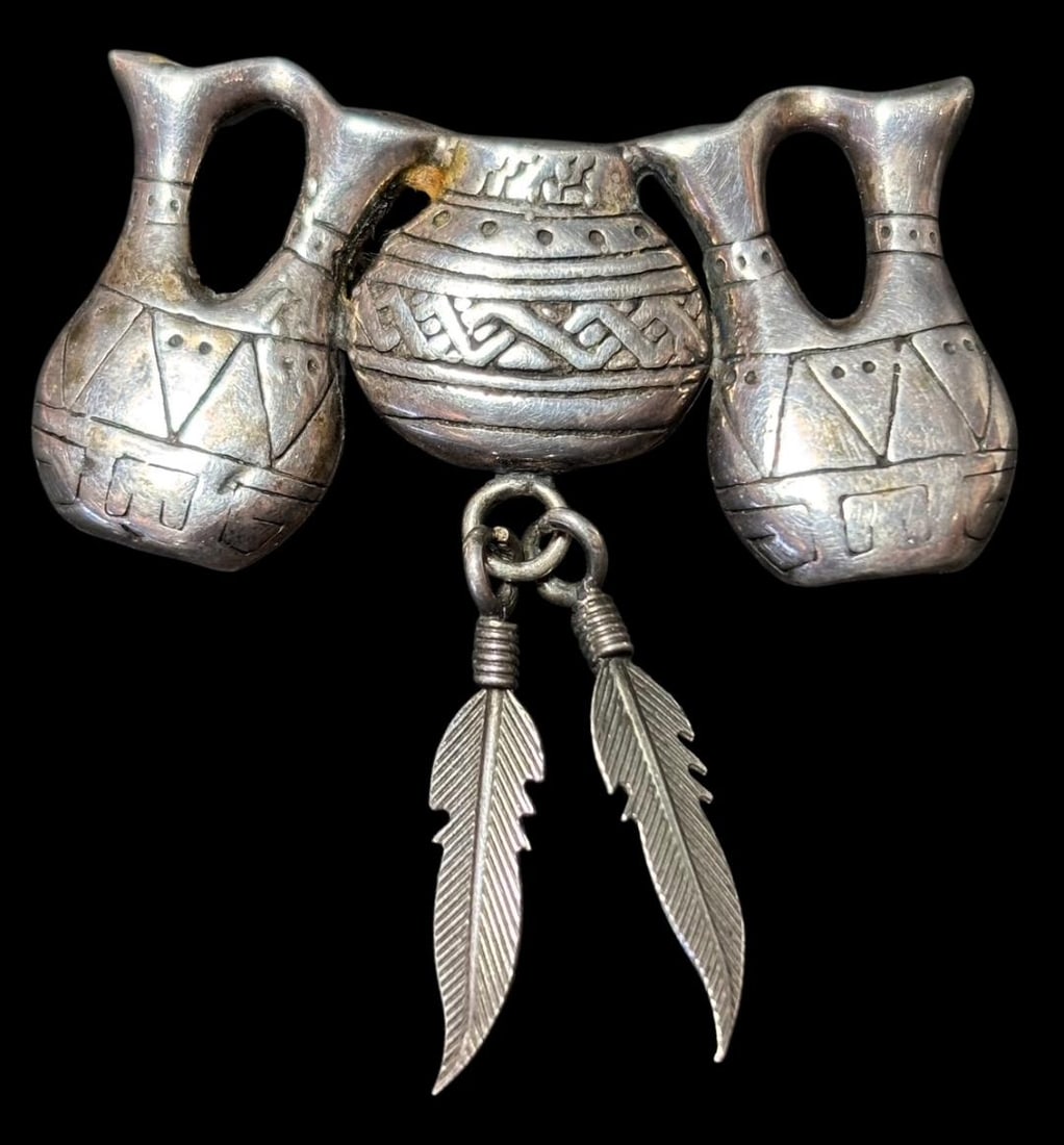 Native American Signed George Sandoval Sterling Pin/Brooch: Native American Navajo sterling pin/brooch with pots and feather design. Marked sterling and signed GS (George Sandoval). Measures 1.75" x 1.75". Domestic shipping $8.