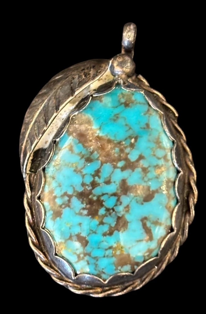 Native American Sterling with Turquoise Pendant Hallmark Signed: Native American sterling and turquoise pendant. Hallmark signed with an arrow. Measures 1.25" x .75". Domestic shipping $8.