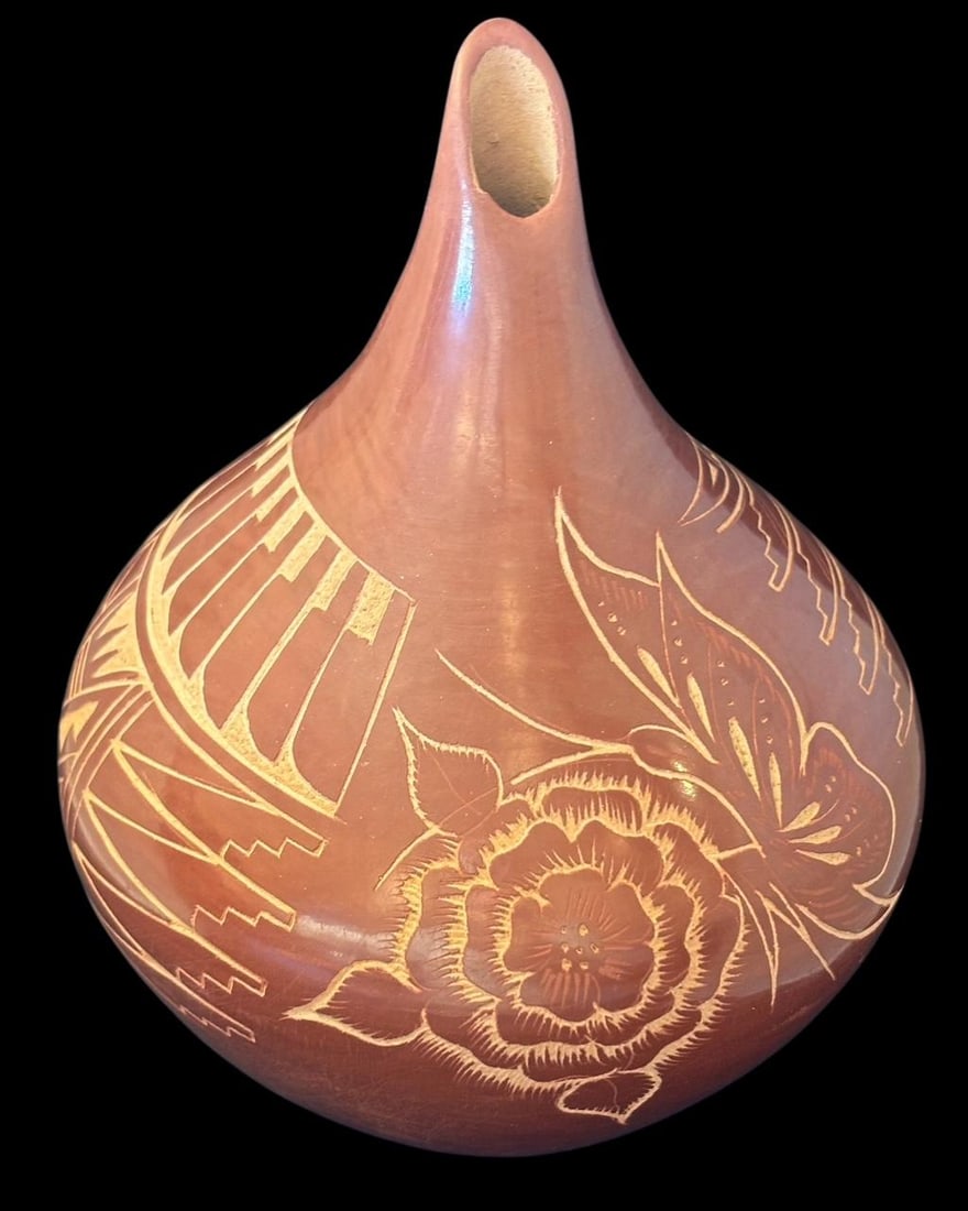 Jemez Pueblo Signed Vangie Tafoya Redware Pot: Jemez Pueblo etched redware pot with a floral and feather design. Signed by Vanie Tafoya. Measures 7.5" high. Domestic shipping $20.