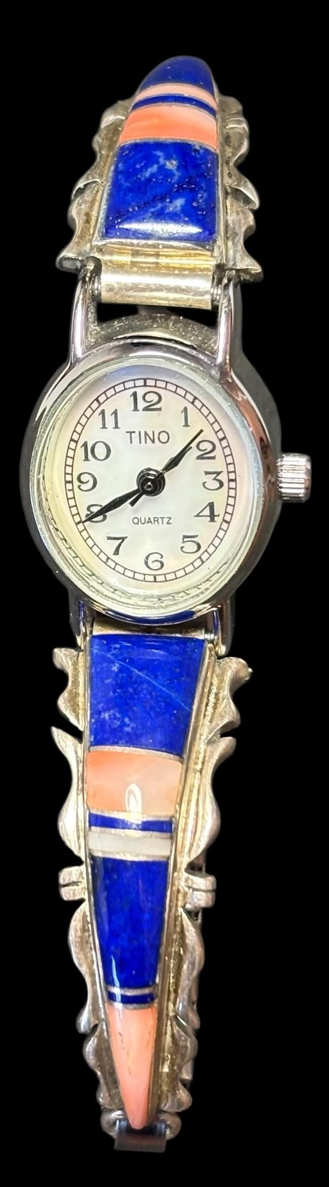 Native American Sterling, Spiny Oyster, Mother of Pearl and Lapis Watch Band: Native American sterling, spiny oyster, mother of pearl and lapis watch band. Hallmark signed. Band is approximately .25" wide and tapers down attached to expandable band. Domestic shipping $10.