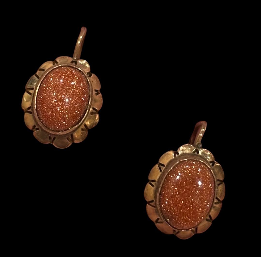 14K Gold Goldstone Earrings: 14k gold Goldstone earrings for pierced ears. Measures .5" long. Domestic shipping $8.