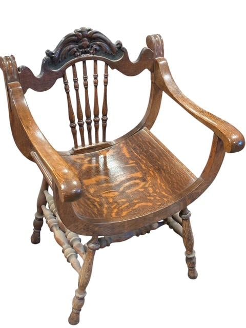 Northwind Face Carved Savonarola Armchair Early 20th Century: Northwind face carved Savonarola armchair. Measures 34" high, 23.5" wide and 17" deep. A ‘Northwind’ carved oak Savonarola chair. This early 20th-century chair features slatted sides and back with
