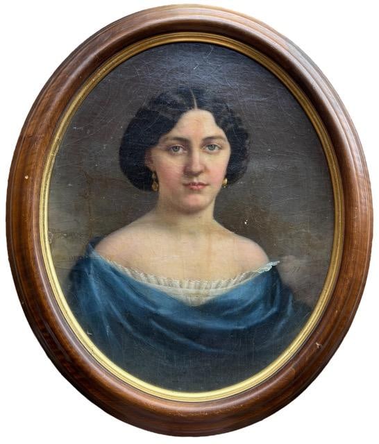 Original Antique Oil on Canvas Painting: Original antique painting of a woman in a blue dress. Unsigned. From Mesilla, New Mexico. Visible art measures 13" x 16.5". Framed art measures 17" x 20.5".