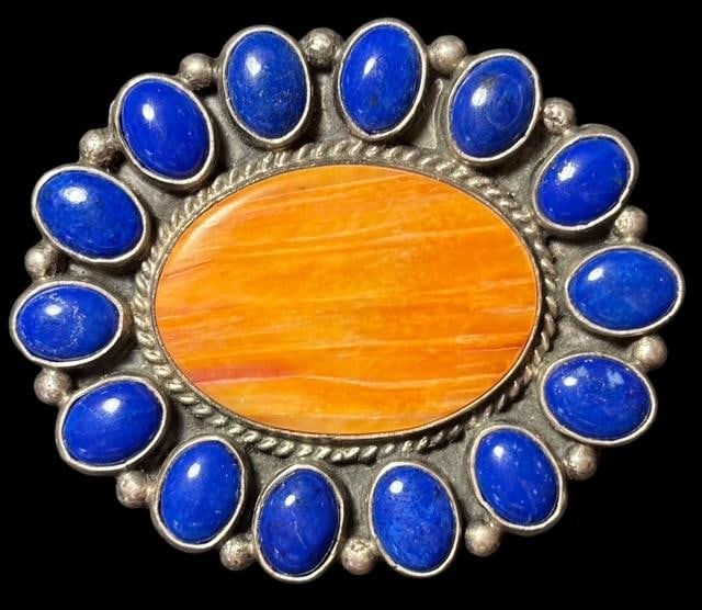 Native American Signed Lapis Pin/Brooch Andy Cadman: Native American brooch with lapis and spiny oyster. Signed A. Cadman (Andy Cadman). Measures 1.5" x 1.5". For in-house shipping, select "bidder arranged". Domestic shipping $6.