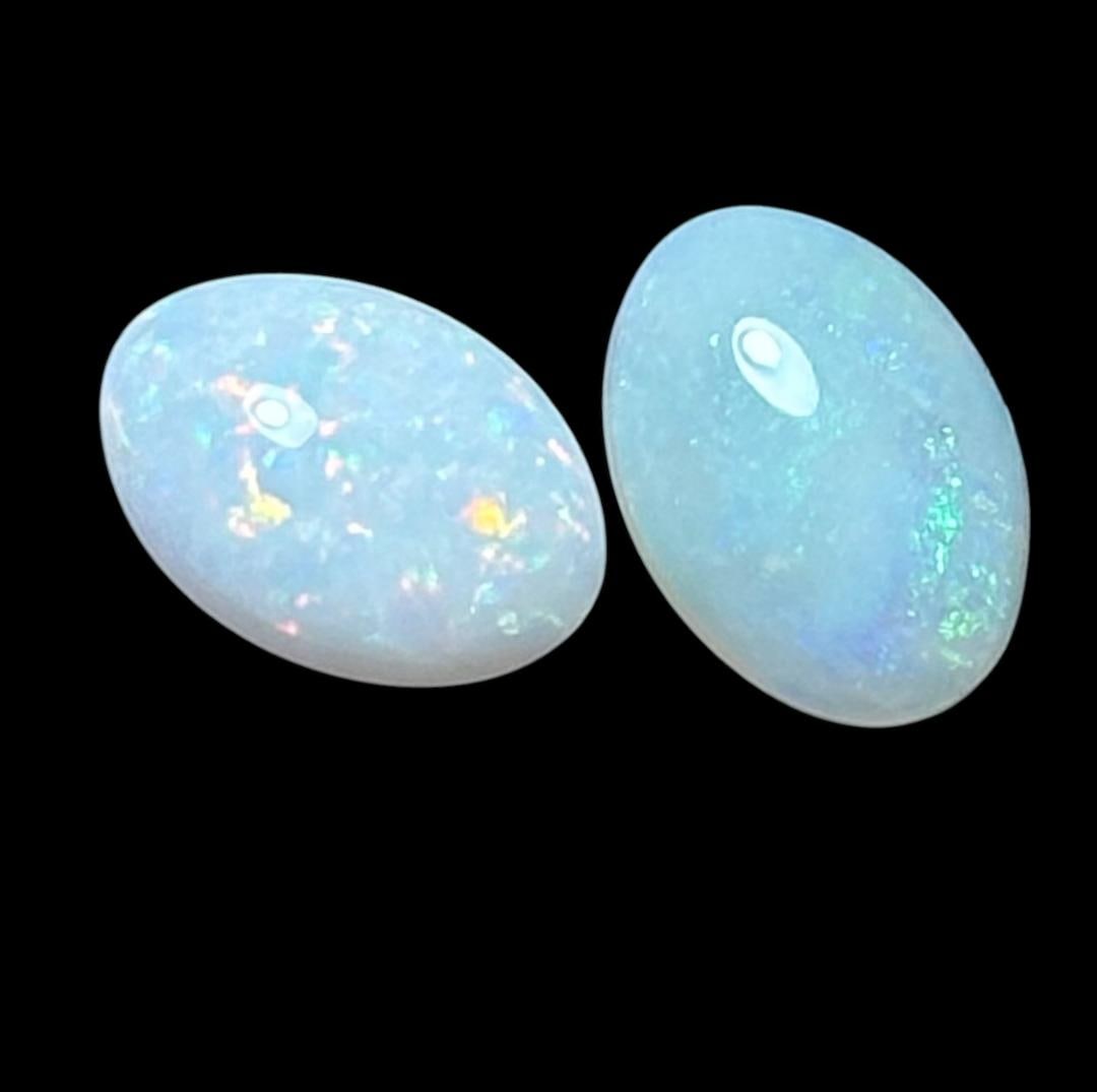 Pair of Opal Cabochons: Pair of opal cabochons. Measure .25". Weighs .1 gram total. For in-house shipping, select "bidder arranged". Domestic shipping $6.