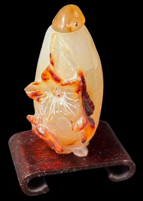 Hand Carved Jade Snuff Bottle: Hand carved jade snuff bottle. Includes wood stand. Measures 2.5". For in-house shipping, select "bidder arranged". Domestic shipping $8