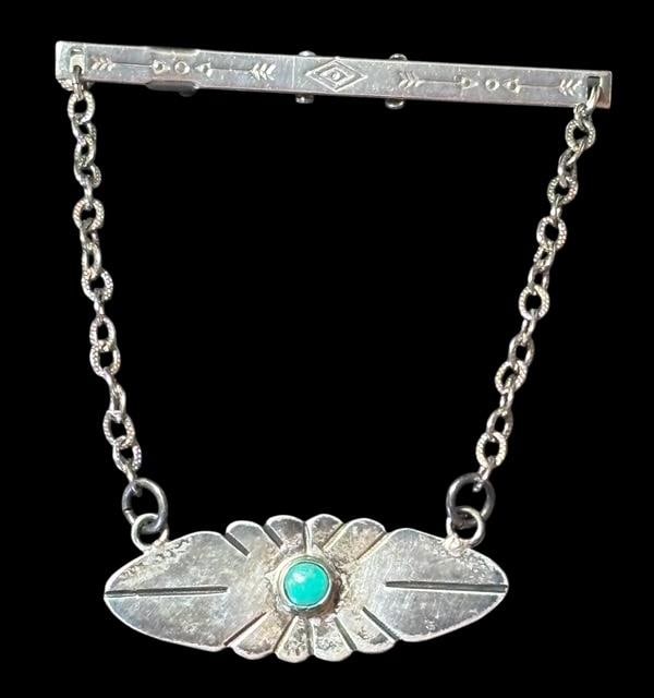 Native American Zuni Sterling and Turquoise Tie Clip Bar: Native American sterling and turquoise tie clip bar. Nice center turquoise stone. Bar measures 2.25". For in-house shipping, select "bidder arranged". Domestic shipping $6.