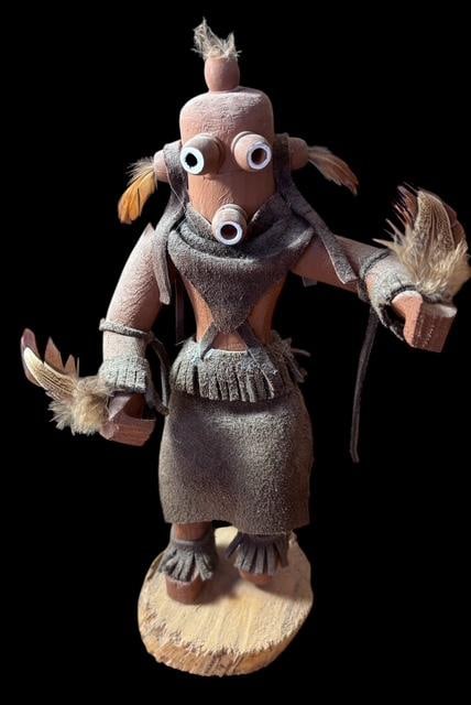 Native American Hand Carved Mud Head Dancer Kachina: Native American signed mud head dancer kachina. Unable to decipher signature. See photos for details. Measures 10" x 3". For in-house shipping, select "bidder arranged". Domestic shipping $16.