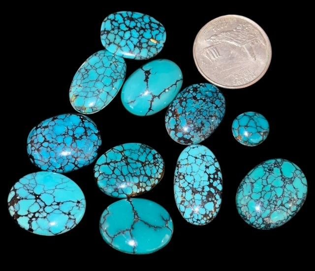 Lot of 11 Turquoise Cabs Including Spider Web Stone: Lot of 11 smooth turquoise cabs. Nice rich color and veining. Quarter for size. For in-house shipping, select bidder arranged. Domestic shipping $8.