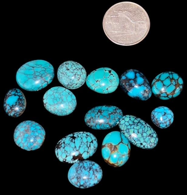 Lot of Nine Turquoise Cabs: Lot of smooth turquoise cabs. Nice rich color and veining. Quarter for size. For in-house shipping, select bidder arranged. Domestic shipping $8.