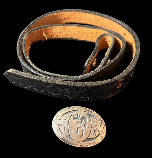 Navajo Leather Belt with Sterling Kokopelli Belt Buckle: Leather belt with sterling silver (tested) belt buckle. Buckle is Hallmark signed and has a Kokopelli design on the front. Belt is 37" long and buckle measures 1.75" x 1.25". For in-house shipping, se