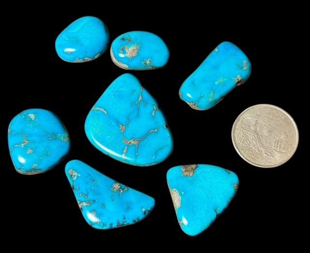 Lot of Seven Turquoise Cabs: Lot of seven turquoise cabs. Bisbee Mines in Arizona. Quarter for size. Have a black backing. For in-house shipping, select "bidder arranged". Domestic shipping $8.