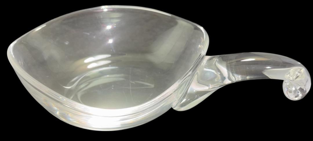 Signed Steuben Art Glass Decorative Bowl: Art glass crystal decorative bowl with handles. Signed Steuben. With handles measures 8.5" x 6" x 1.75". For in-house shipping, select "bidder arranged". Domestic shipping $18.