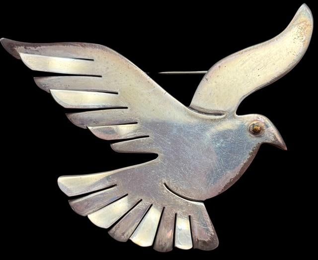 Taxco Sterling Dove Pin: Taxco sterling dove pin. Marked TR-89 and .925. Measures 2.5" x 2.5" and weighs 12.9 g. For in-house shipping, select "bidder arranged". Domestic shipping $6.