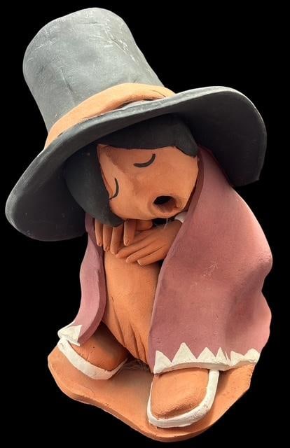 Native American Taos Pueblo Signed Juan Sandoval Pottery Figure: Native American Taos Pueblo hand painted pottery figure. Signed Juan Sandoval. Great detail and very colorful. Measures 6.25" x 5" x 4.75".