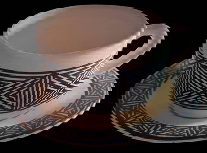 Native American Miniature Signed Acoma Cup and Saucer: Native American (unmarked Acoma) miniature cup and saucer. Signed G.V. Cup measures 1.75" x 1". Saucer measures 2.75" around.