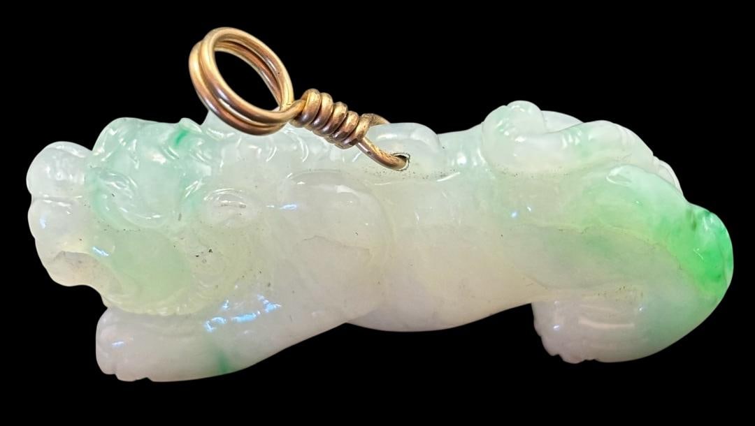 Green and White Jadeite Tiger Pendant: Jadeite tiger pendant. Measures 1.75" long.