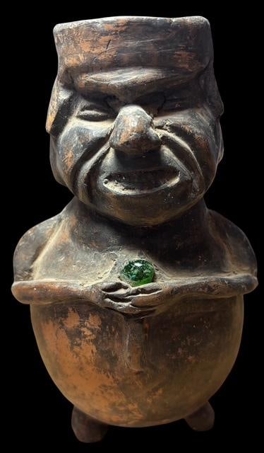 Nazca Pre Columbian Pottery Vessel with Embeded Green Jewel: Central American Pre Columbian carved vessel with an embedded green jewel. Museum of Man San Diego, California. 7" tall.