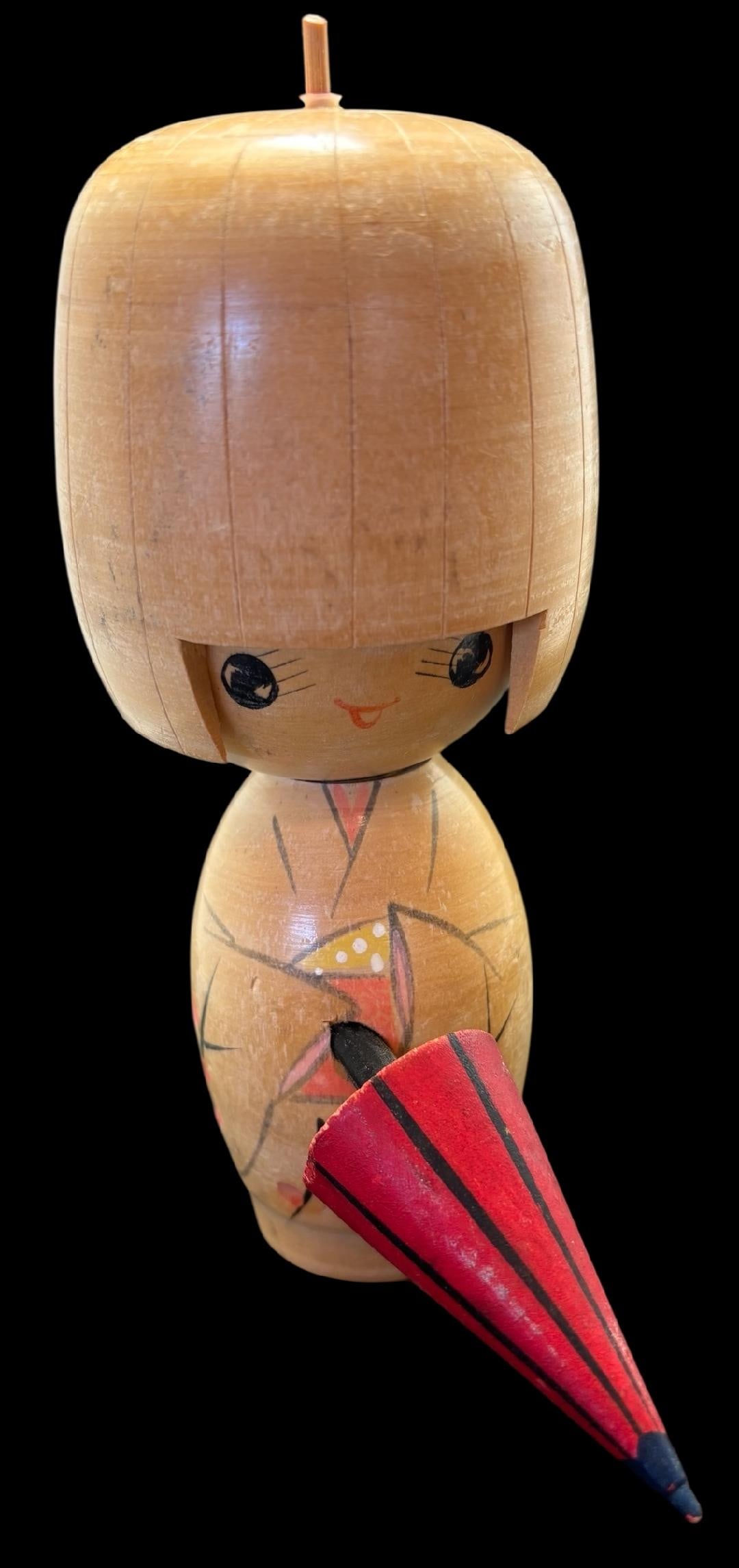 Vintage Japanese Kokeshi Wood Doll: Vintage hand painted and carved Kokeshi doll. Stamped mark on bottom. Measures 6" tall.