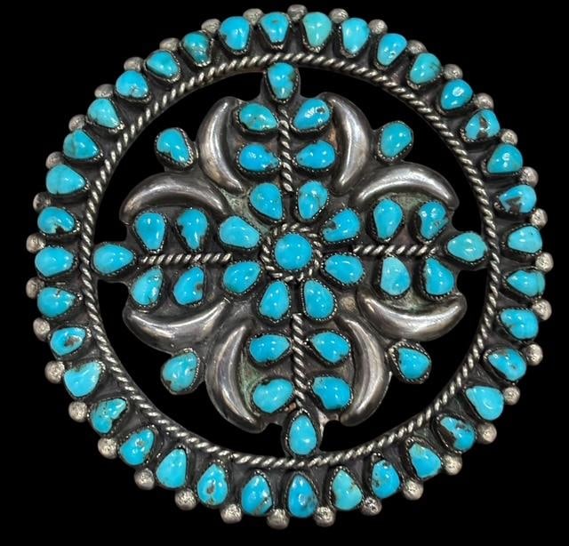 Native American Zuni Petit Point Silver and Turquoise Brooch: Native American Zuni turquoise and sterling round shaped brooch. Unsigned. Measures 2.75" around.
