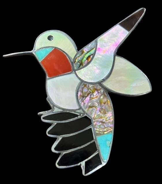 Native American Zuni Signed Sterling and Stone Hummingbird Shaped Brooch: Native American sterling with shell, turquoise, onyx, mother of pearl and coral inlaid hummingbird design brooch. Signed Bobby & Corraine Shank and Zuni NM. Measures 1.75" x 2".