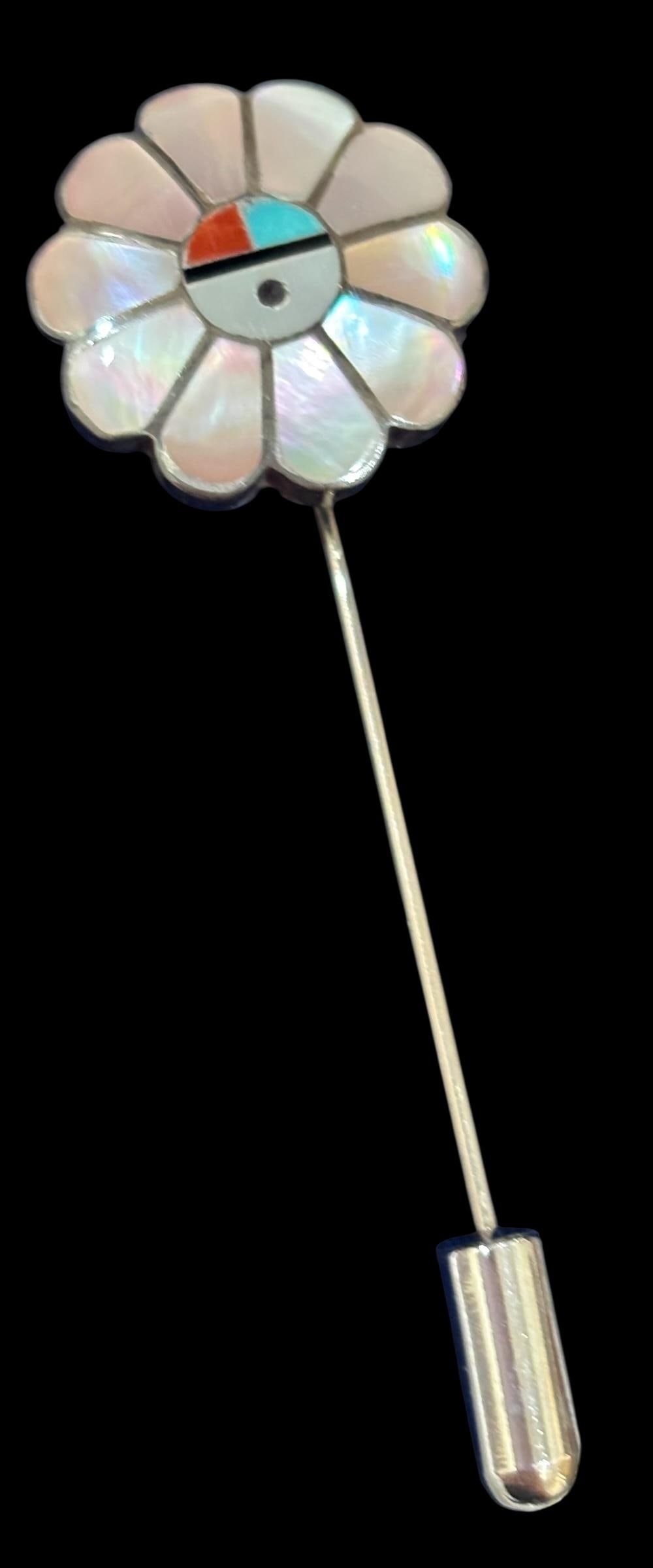Native American Zuni Stick Pin: Native American Zuni stick pin inlayed with mother of pearl, coral, turquoise and onyx. Inlaid design is set in sterling, and pin is stainless. Measures 2.5" long. Unsigned.