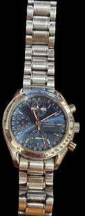 Omega Men's Speedmaster Watch in Original Box: Omega men's speedmaster watch with original box and paperwork. Purchased in Alaska 5/25/02. Marked 3523.80, watch No. 57831415.