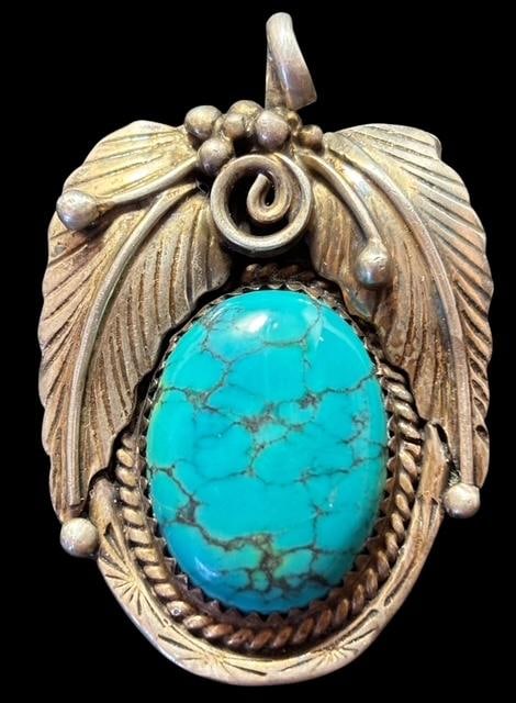 Native American Navajo Sterling and Turquoise Pendant Signed John Mike: Native American Navajo sterling and turquoise pendant. Signed John Mike. Marked sterling. Measures 1.5" x 1". Lovely turquoise cab.